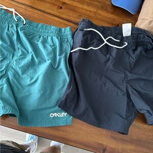 Oakley Board shorts/ swim trunks, lot of 2. Both pair included in the price.